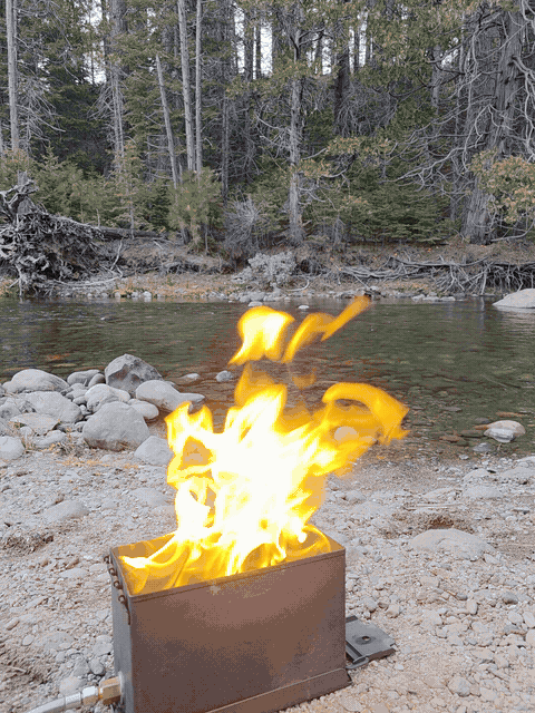 FireCrateUSA ammo can propane fire pit burning at camp